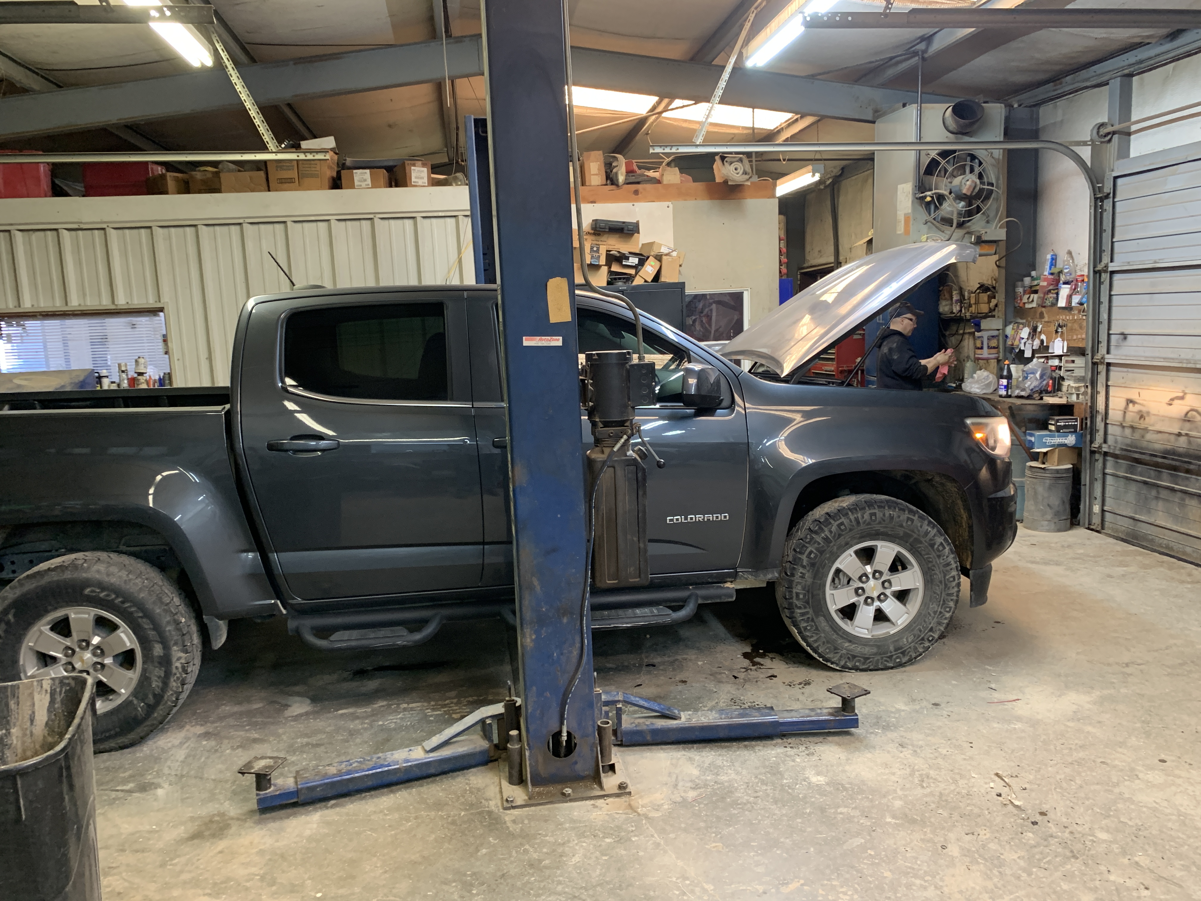 Technician running a check engine light diagnostic scan on a vehicle at Affordable Auto Repair in Graham, TX