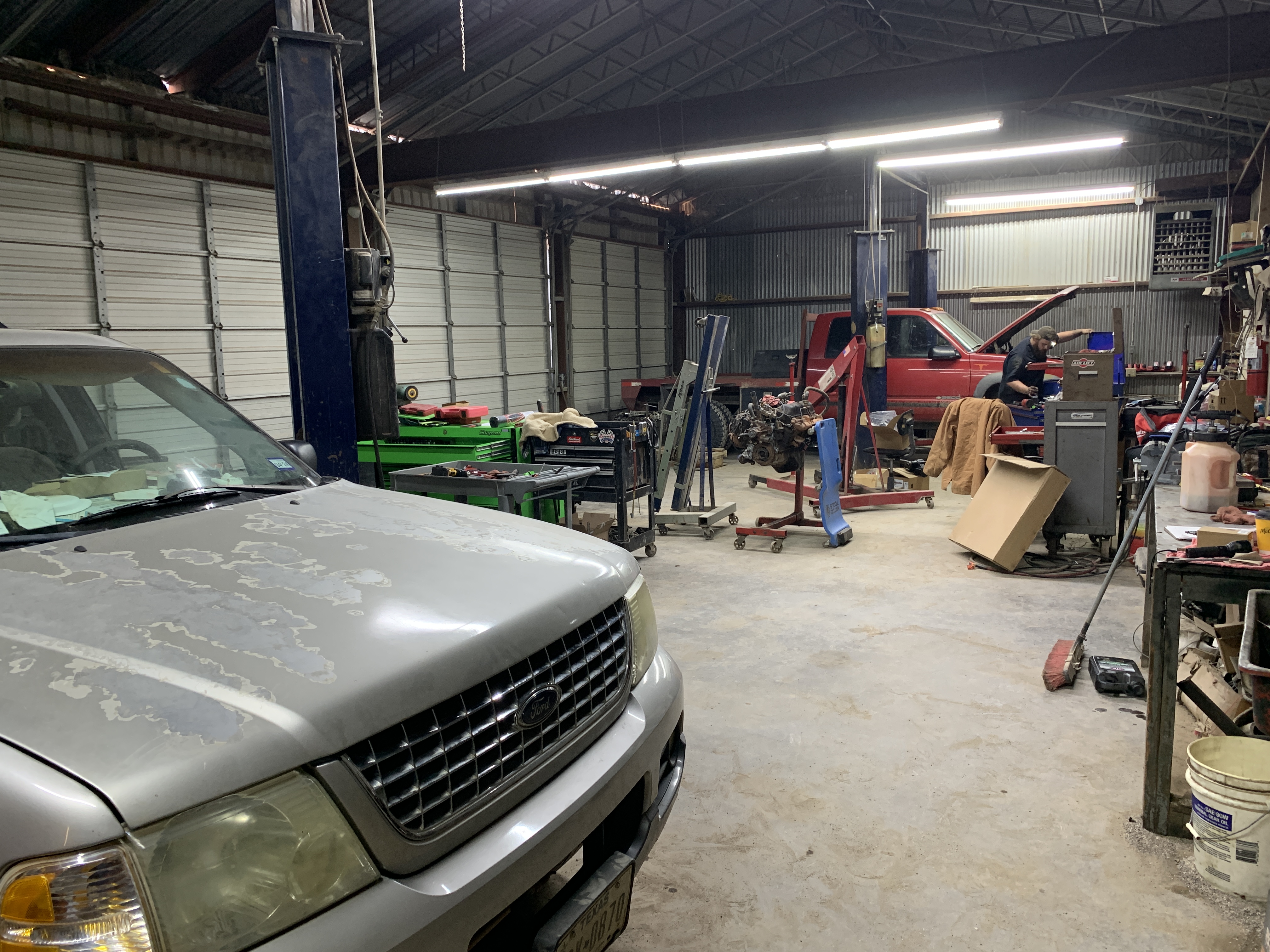 Vehicles in for brake service inside the Affordable Auto Repair shop in Graham, TX