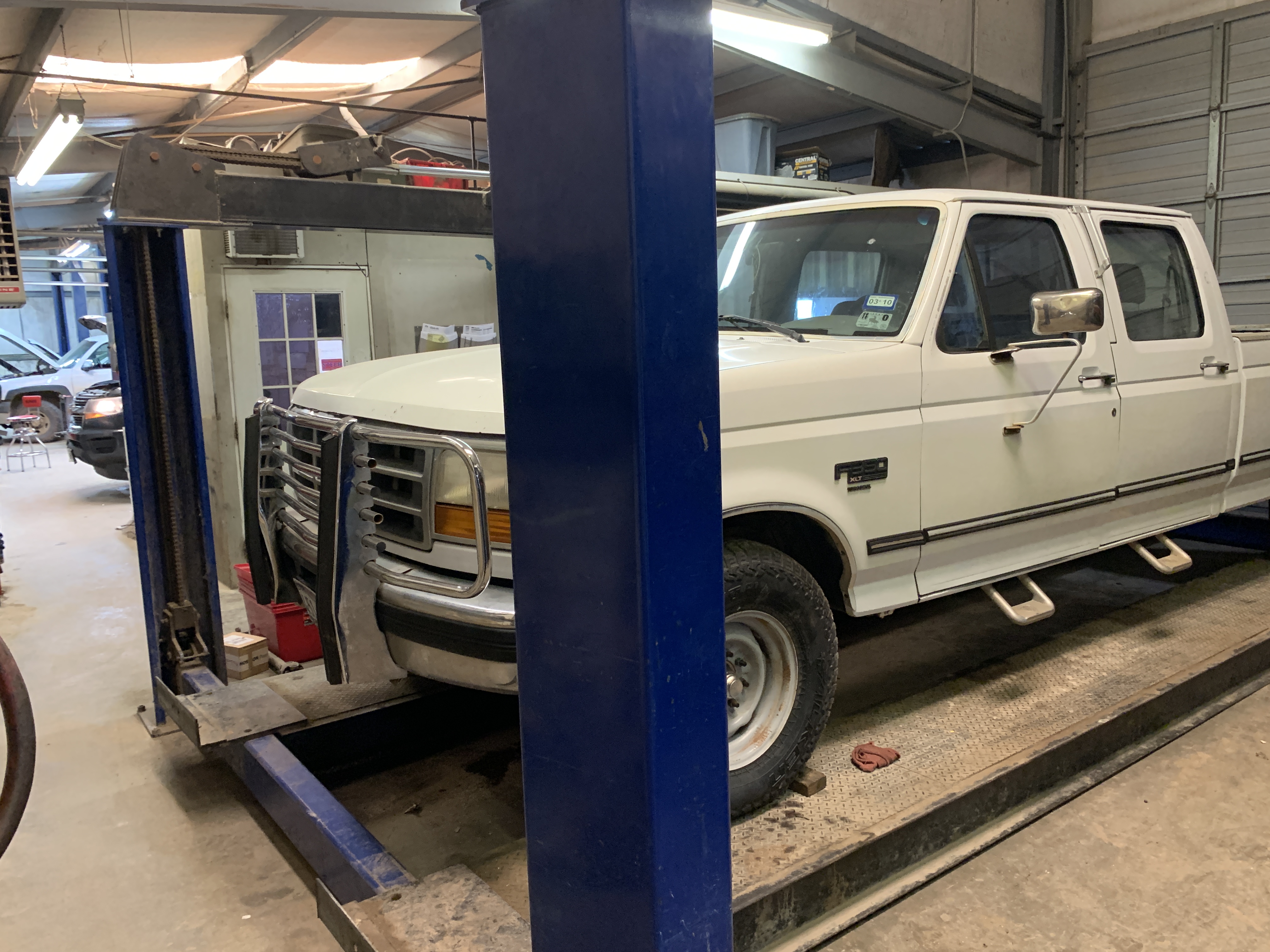 A truck raised for a full undercarriage safety check during state inspection in Graham, TX